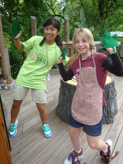 SAGE member interacting with young visitor